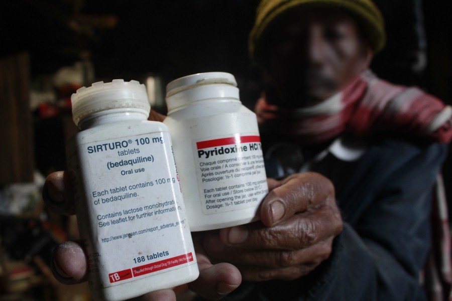 1.	A man seen holding a drug regimen used for treatment of tuberculosis, specifically, multi-drug-resistant tuberculosis (bedaquiline) along with other medications for tuberculosis.